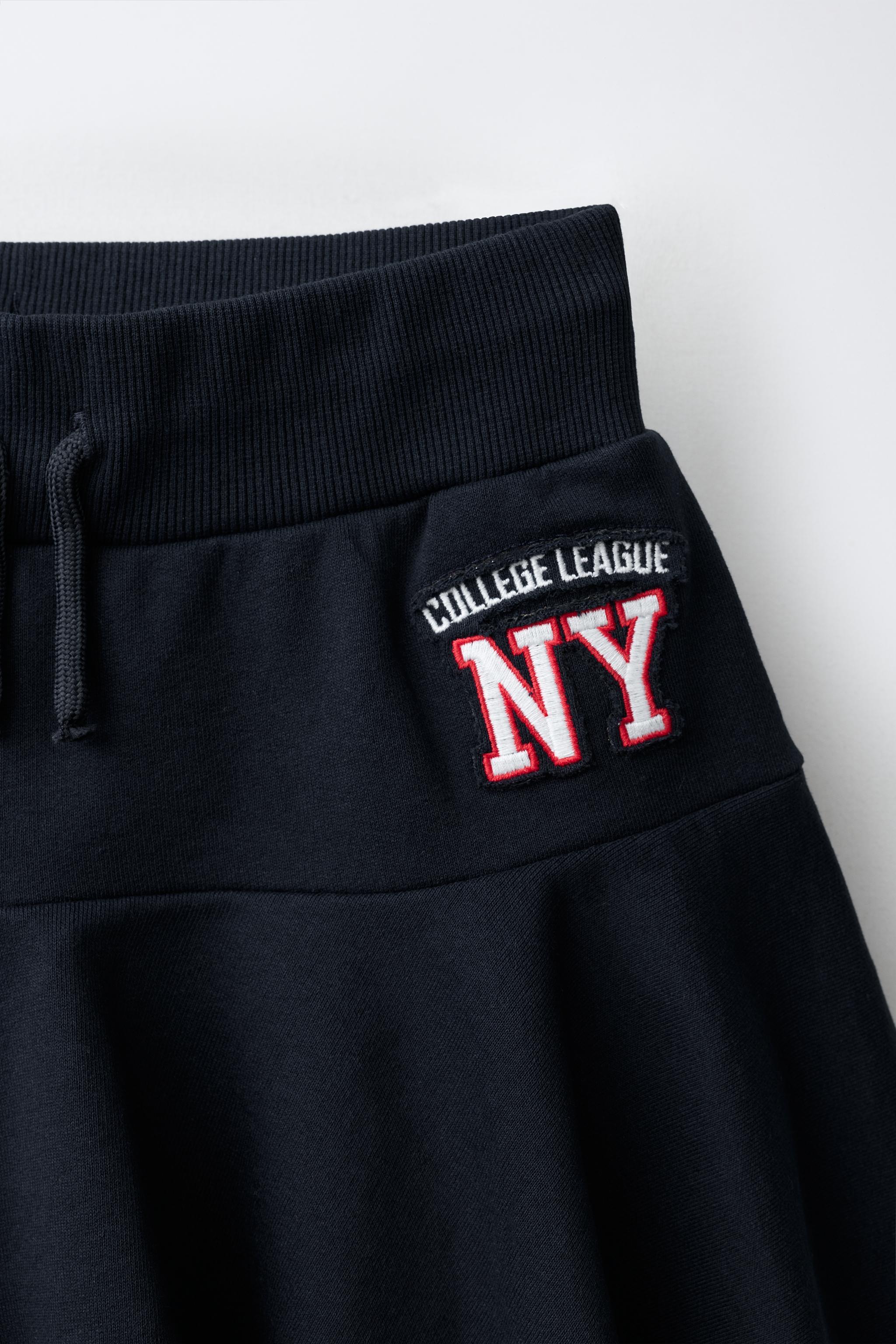 NY EMBROIDERED RUFFLE SKORT